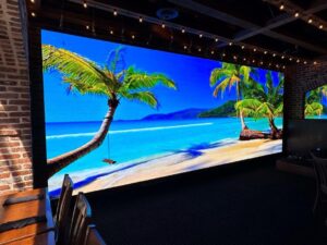 Jumbo video wall projecting a tropical beach at Nick's in OCMD